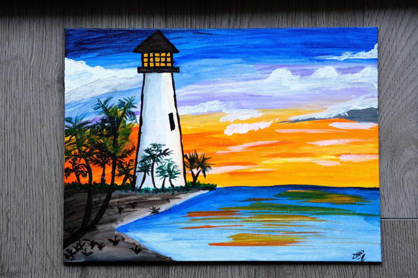 Original painting of a lighthouse by the lake at sunset on 9x12" canvas, with vibrant colors and intricate details of the landscape.